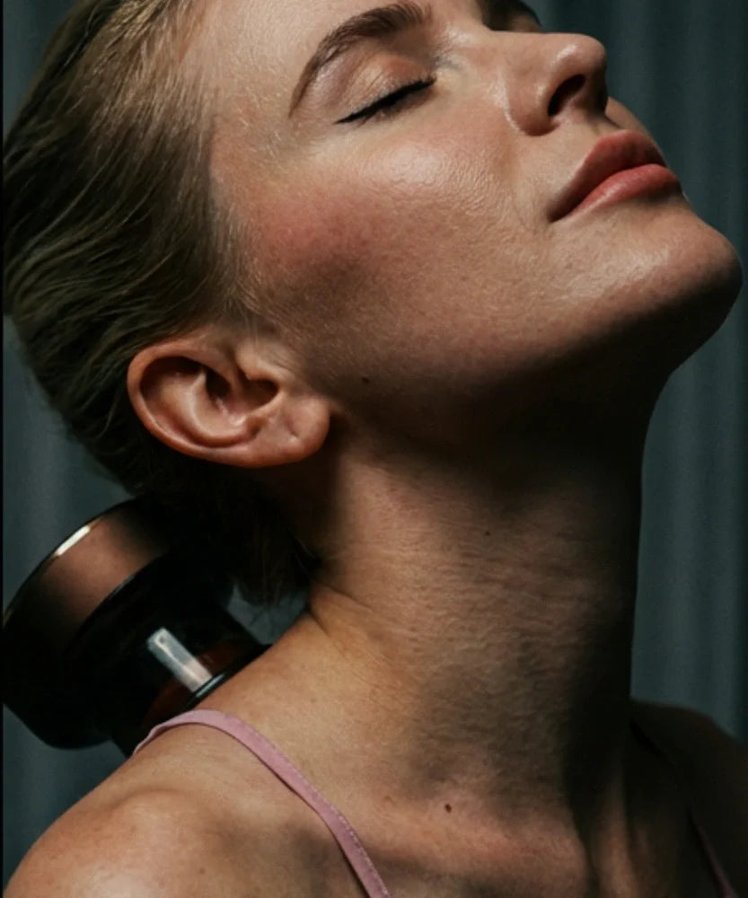 Close-up of a woman enjoying self-care with Wellness Essentials for a radiant glow.