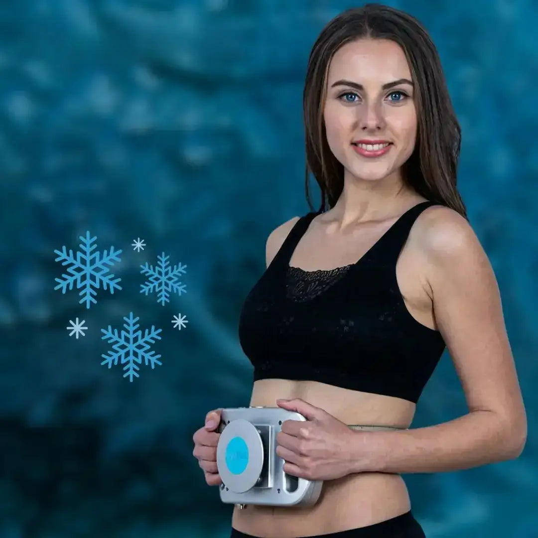 Woman using CryoPad-X Cryo Sculpt Device on her abdomen, smiling with a background of blue snowflakes.