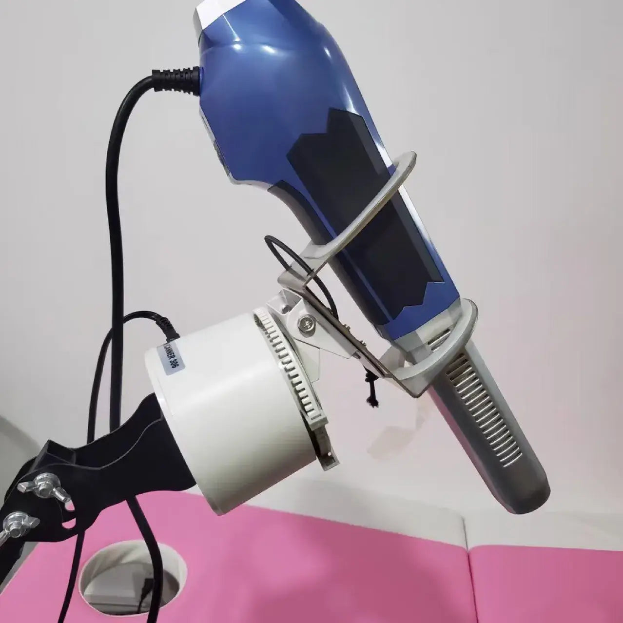 Biomax Motorized Stand holding a professional hair dryer for hands-free styling and convenience.