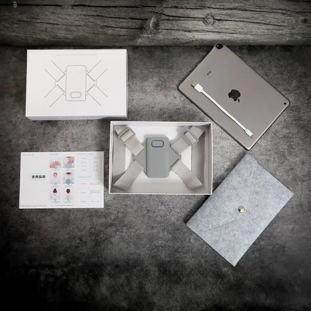 Halipax Smart Posture Trainer packaging and accessories on a wooden surface.