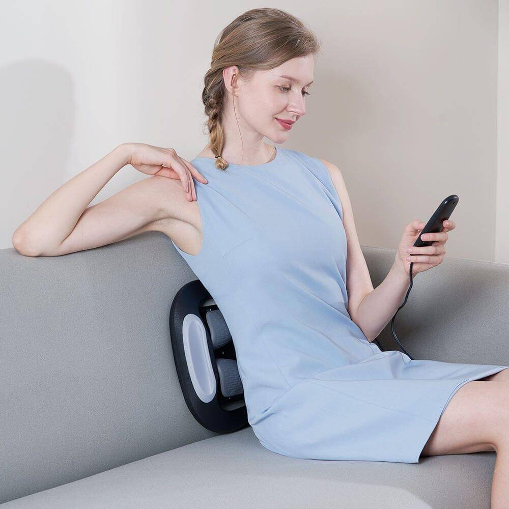 SpineFlex multifunctional back stretcher by HALIPAX placed on the couch