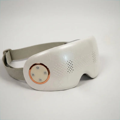 Auri 3D Steam Eye Massager with a sleek design featuring a comfortable strap and soothing vents for relaxation.
