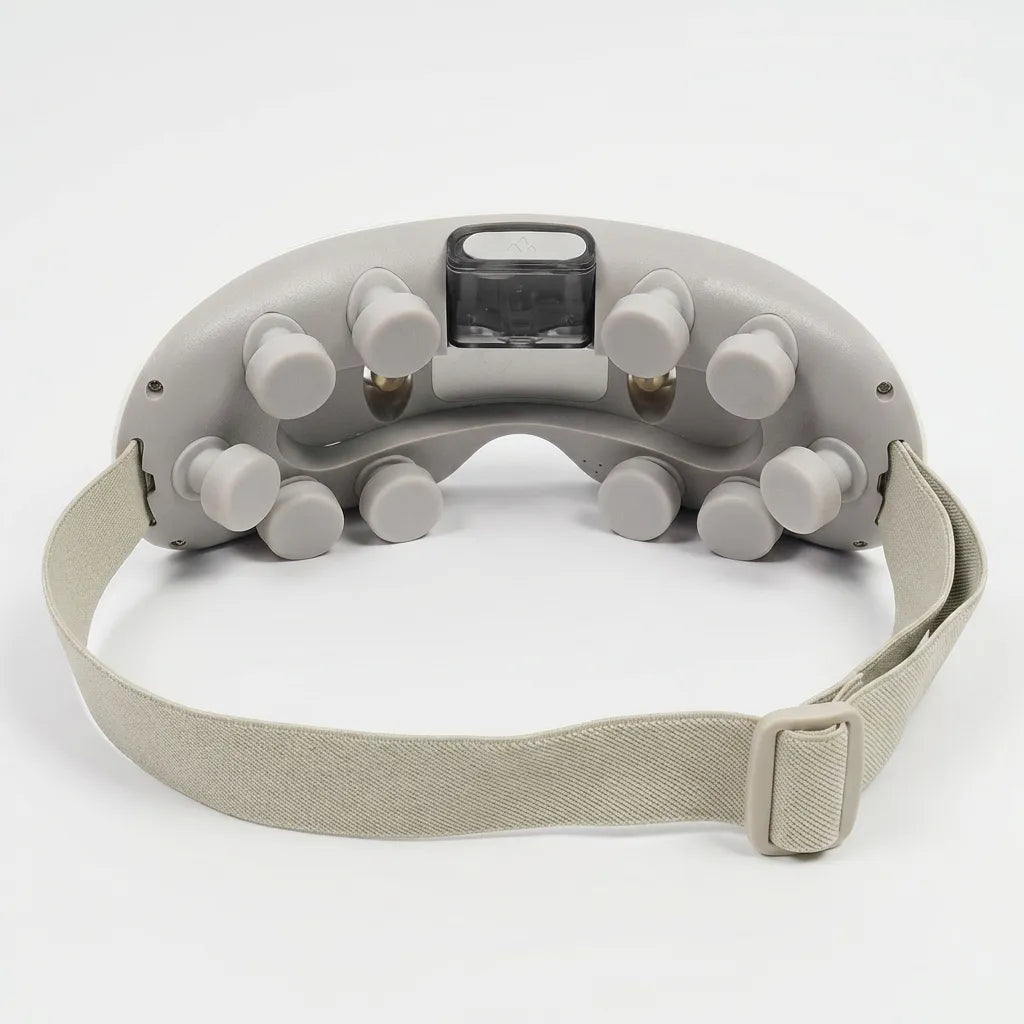 Back view of the Auri 3D Steam Eye Massager showing buttons and strap for secure fit.