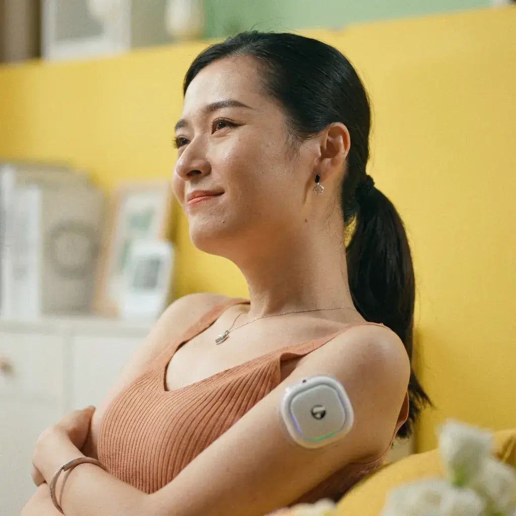 Relaxed woman using the Fitdash Mini Cupping Tool on her arm for daily self-care and recovery.
