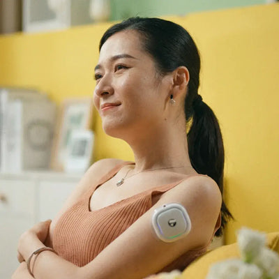 Relaxed woman using the Fitdash Mini Cupping Tool on her arm for daily self-care and recovery.