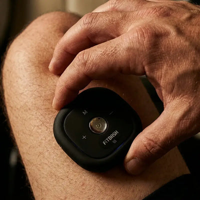 User applying Fitdash Mini Cupping Tool for targeted relief on the knee.