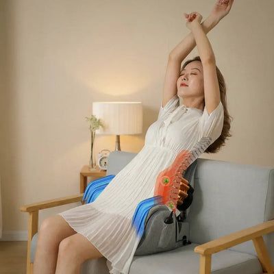 Woman relaxing with the Hipology Massage Seat, enjoying hip and waist relief in a cozy living room.