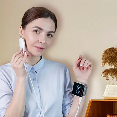 Woman using Hyper-Watch Cold Laser Device on wrist while holding a probe against her face.
