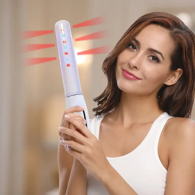 Woman holding the Femniva Wellness Wand with colorful lights, highlighting its design for postpartum comfort.