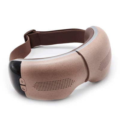 Visura 3D Eye Massager in a soft beige design, featuring control buttons and a comfortable strap.