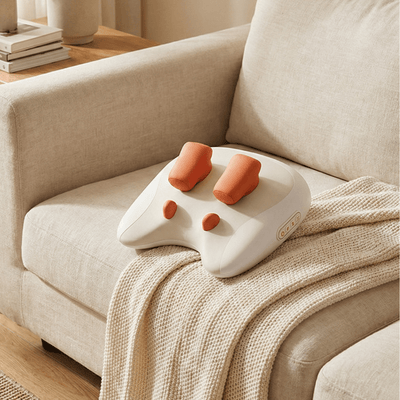 XRP Neck Massager on a cozy couch, designed for deep neck relief and relaxation at home.