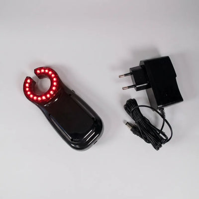 VeinHunter Vein Finder device with a charging adapter and power cord for improved vein visibility.